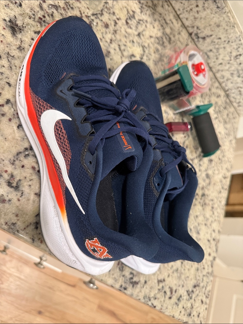 Nike Navy Running Shoes with White Swoosh and Orange Trim